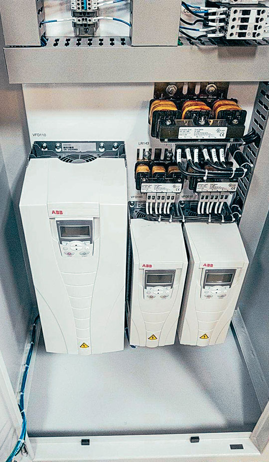 The wiring inside an industrial control panel